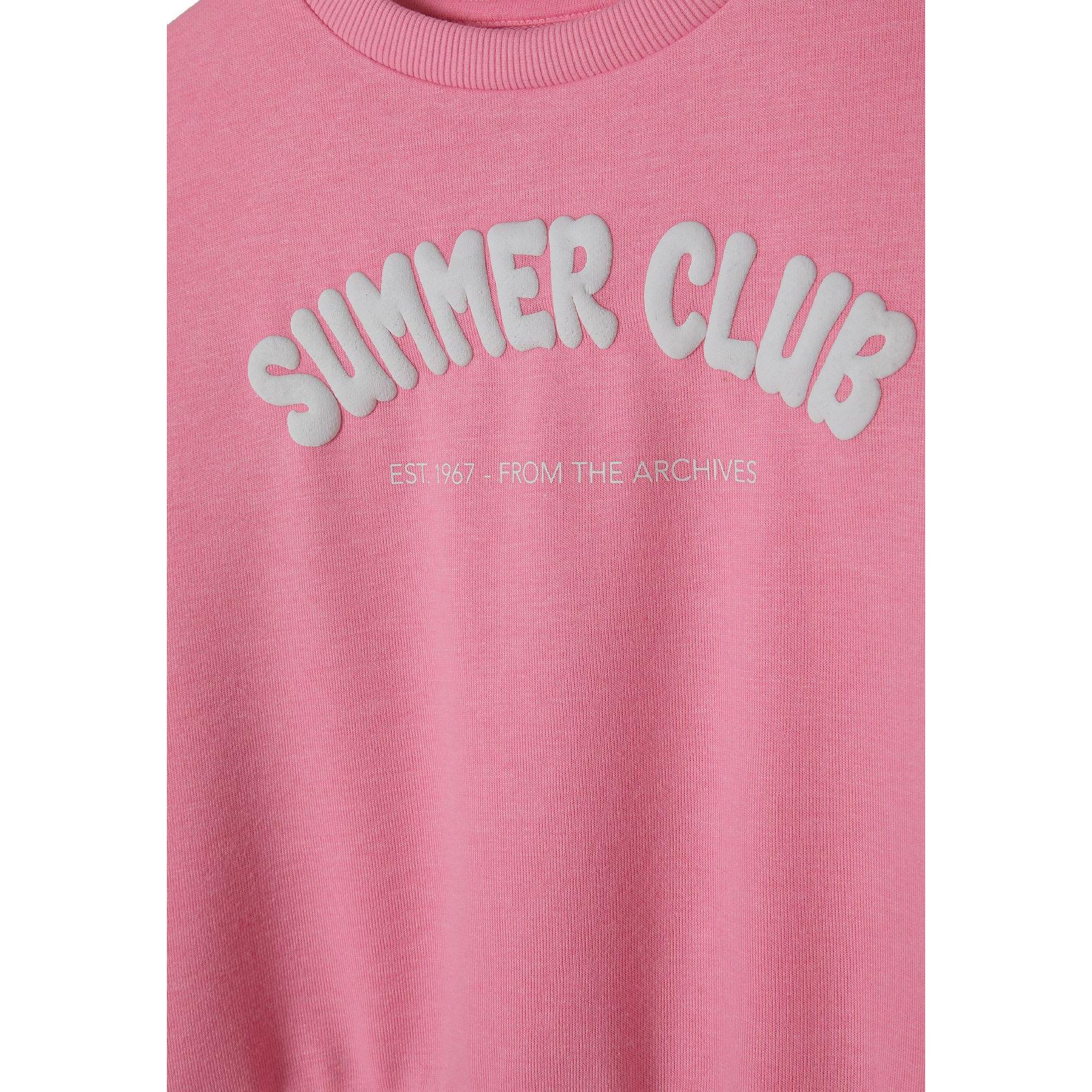 Close-up detail of Summer Club print on pink fleece sweatshirt showing white lettering and 'Est 97 From The Archives' text