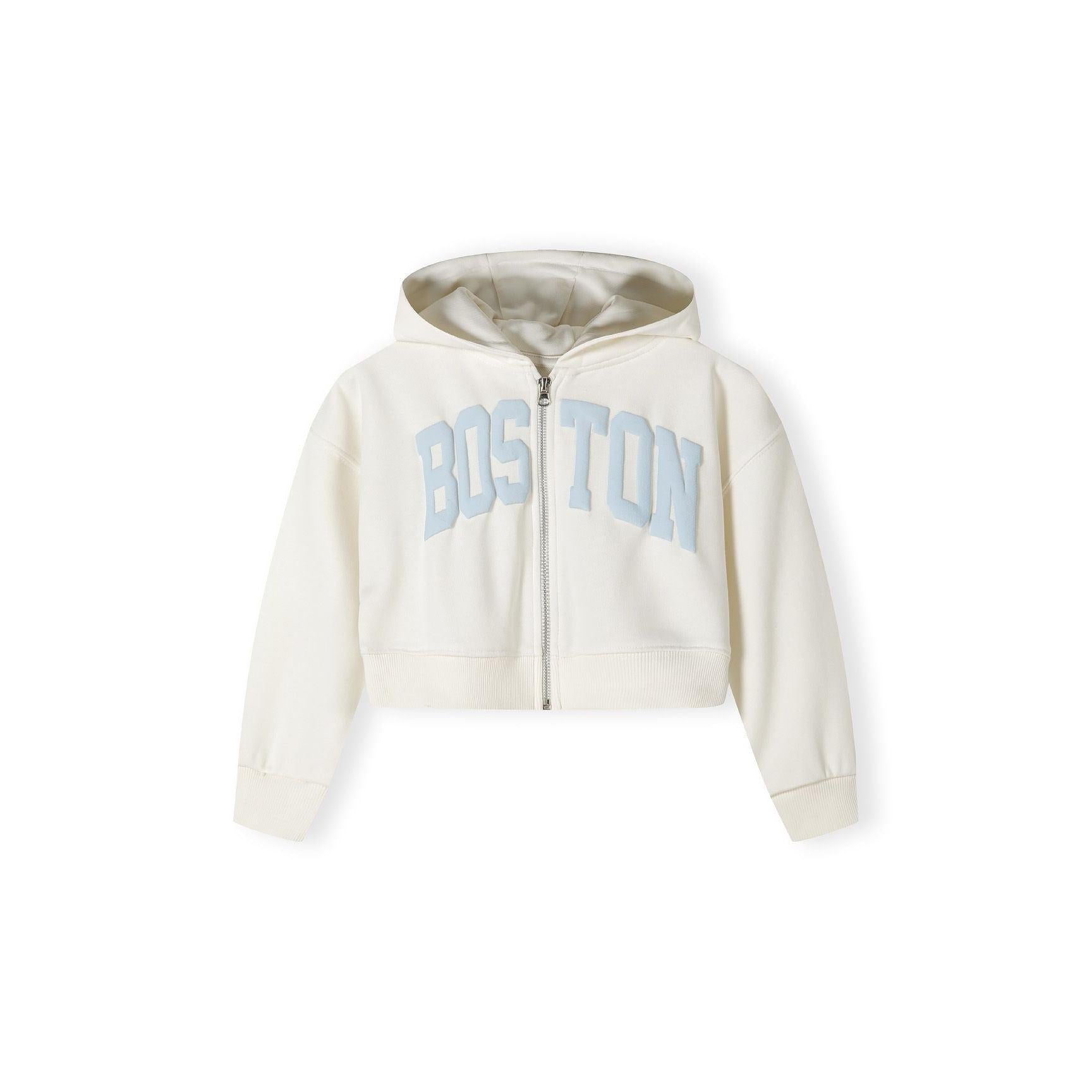 Close-up detail of cream joggers showing blue vintage-style text print reading 'USA 1967' with memories script text