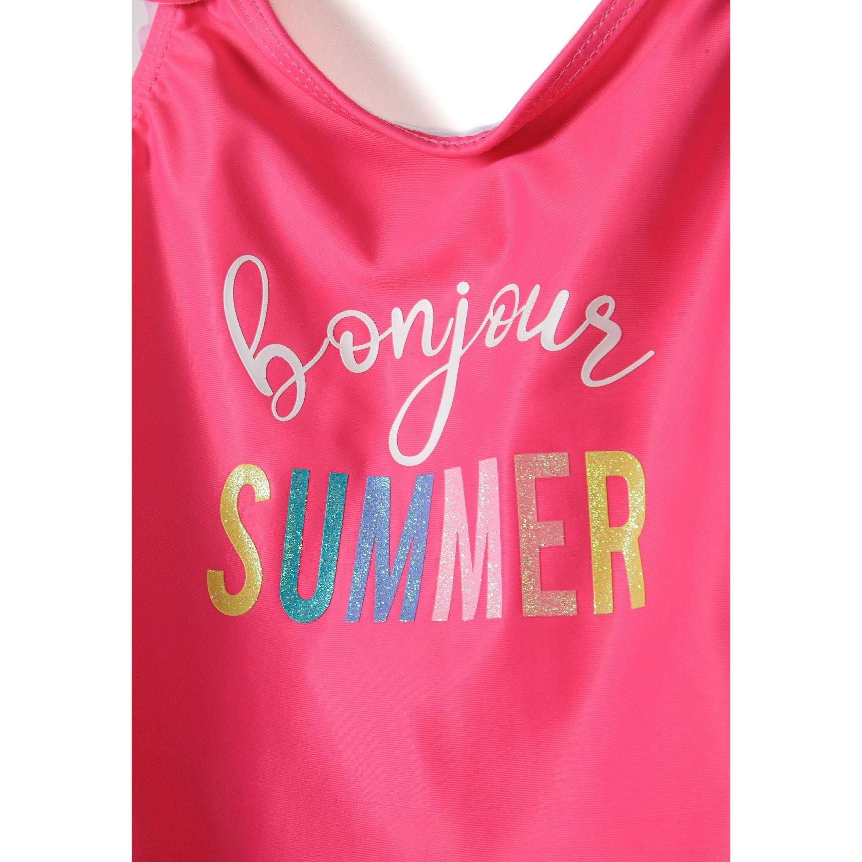 Close-up detail of pink swimsuit showing 'Bonjour Summer' text in white script and colorful metallic foil letters