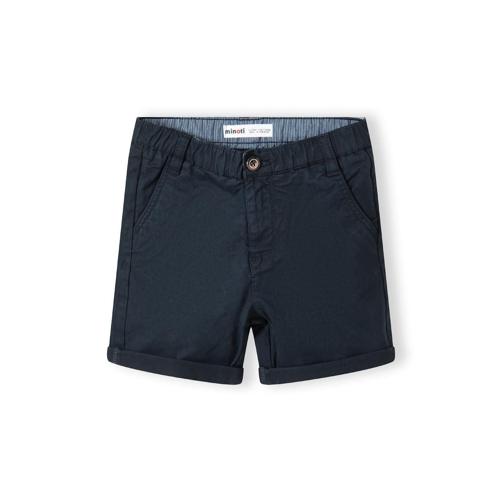 Close-up detail of navy shorts showing adjustable waistband with brown button and pocket construction