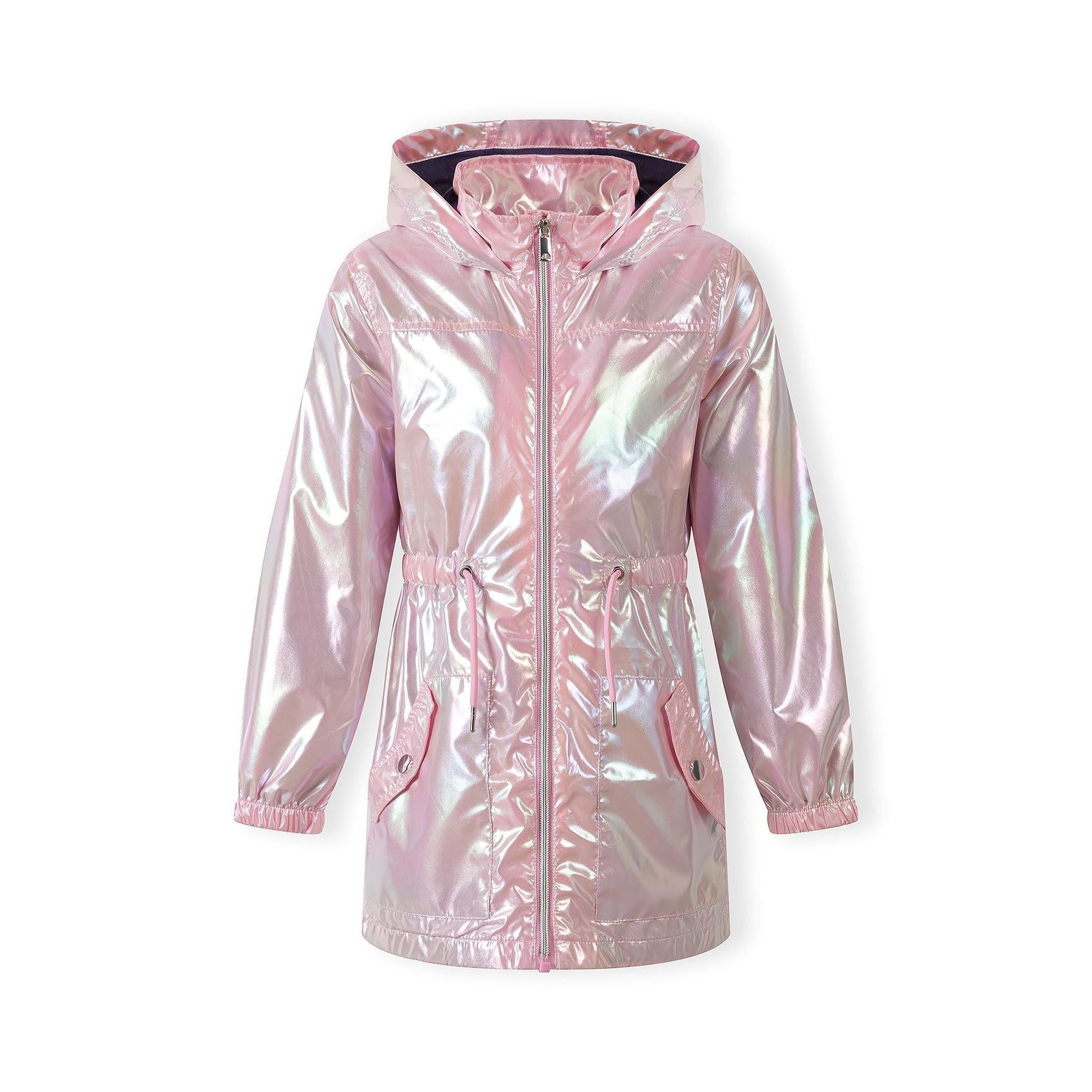 Same girl smiling in the pink shimmery jacket with hands on hips, showing full outfit including pink trousers and white trainers