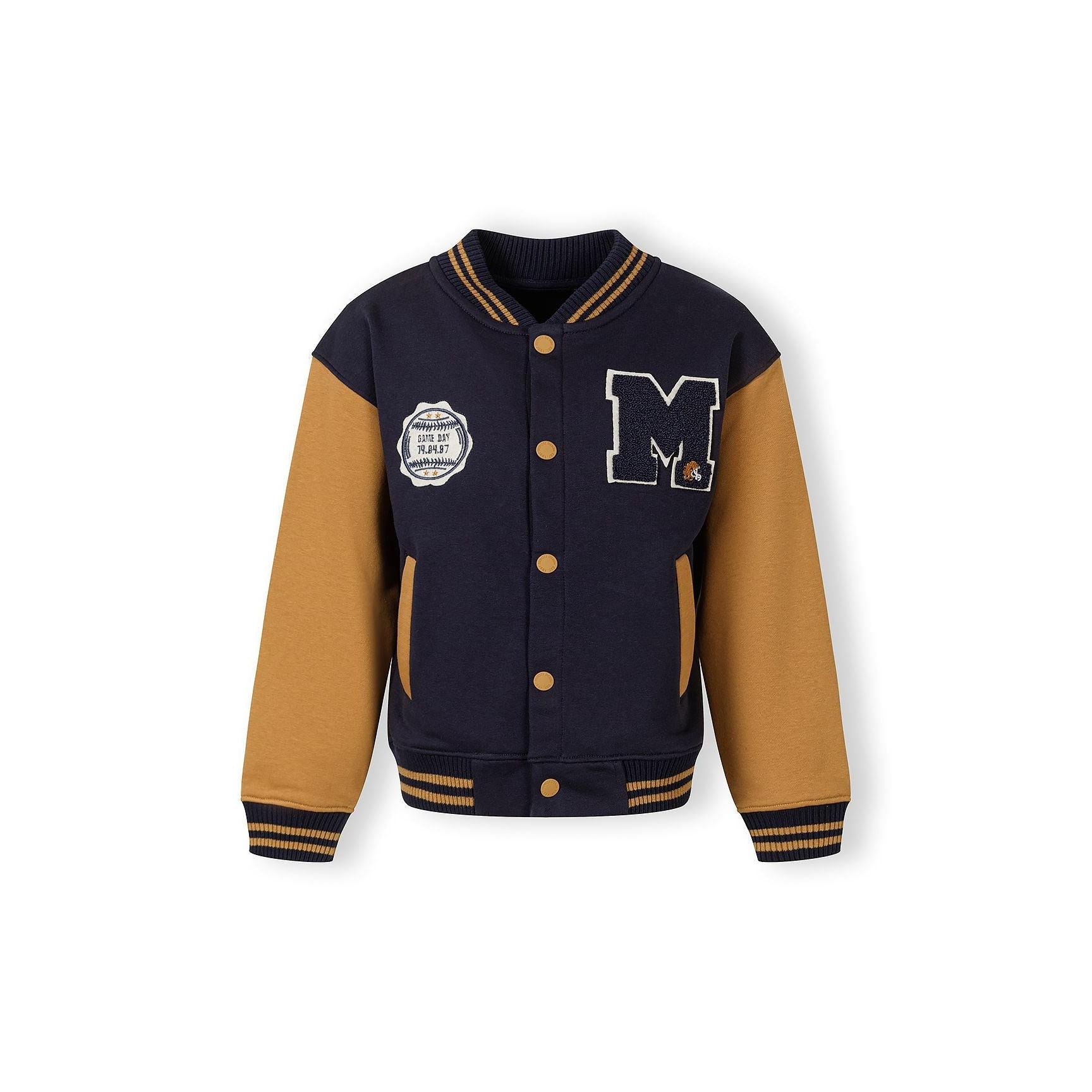 Back view of navy baseball jacket with toffee sleeves showing ribbed collar and cuffs on white background