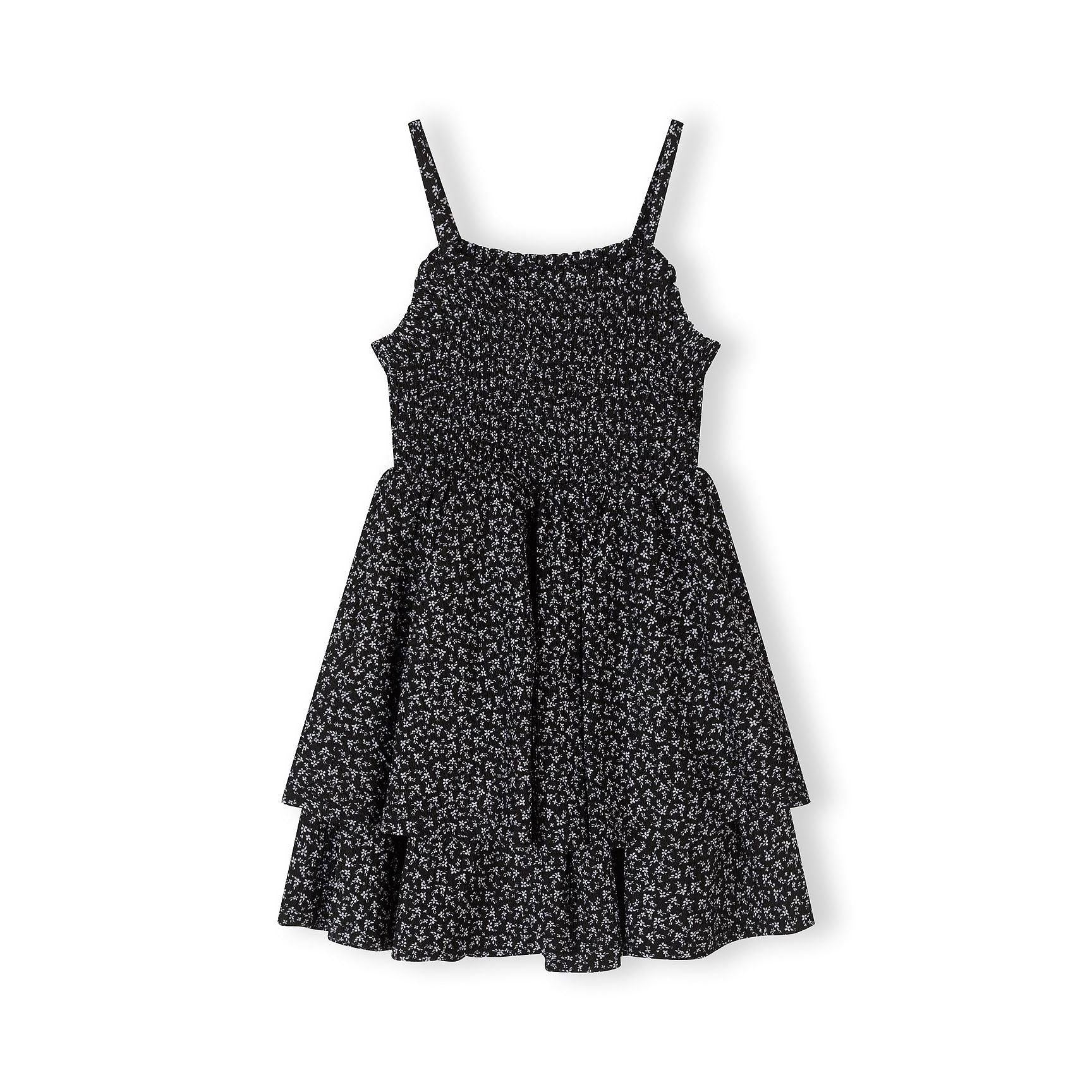 Same black floral dress shown from front view displaying the fitted bodice, adjustable shoulder straps and layered tiered skirt detail on white background