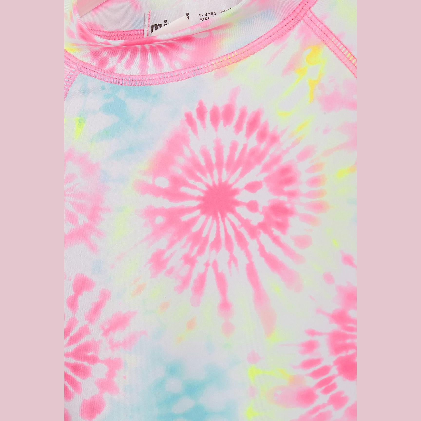 Close-up detail of aqua blue swim t-shirt showing small white palm tree embroidered logo on chest area