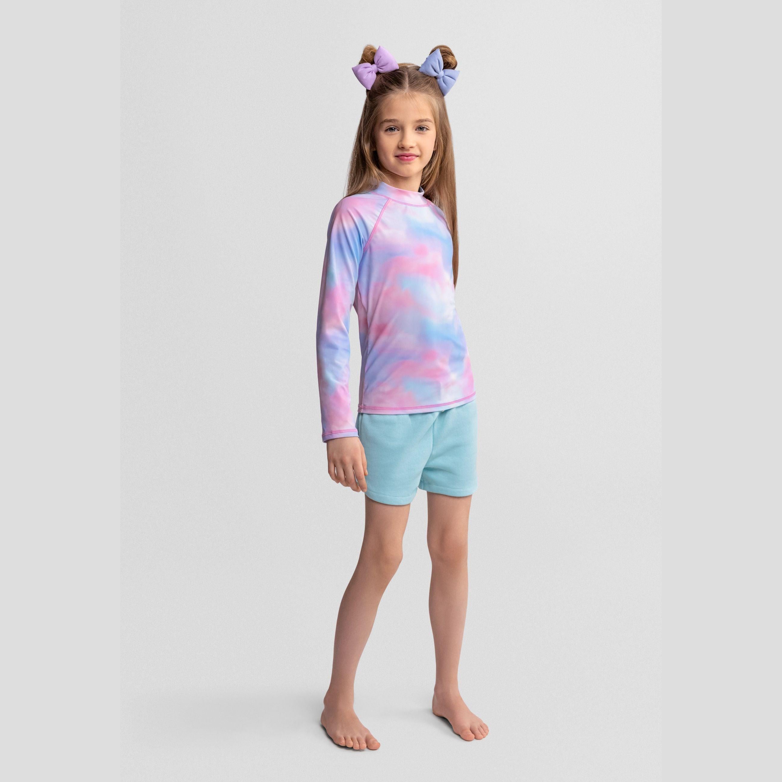 Back view of pastel tie-dye long sleeve swim t-shirt showing raglan sleeve construction and crew neck design on white background