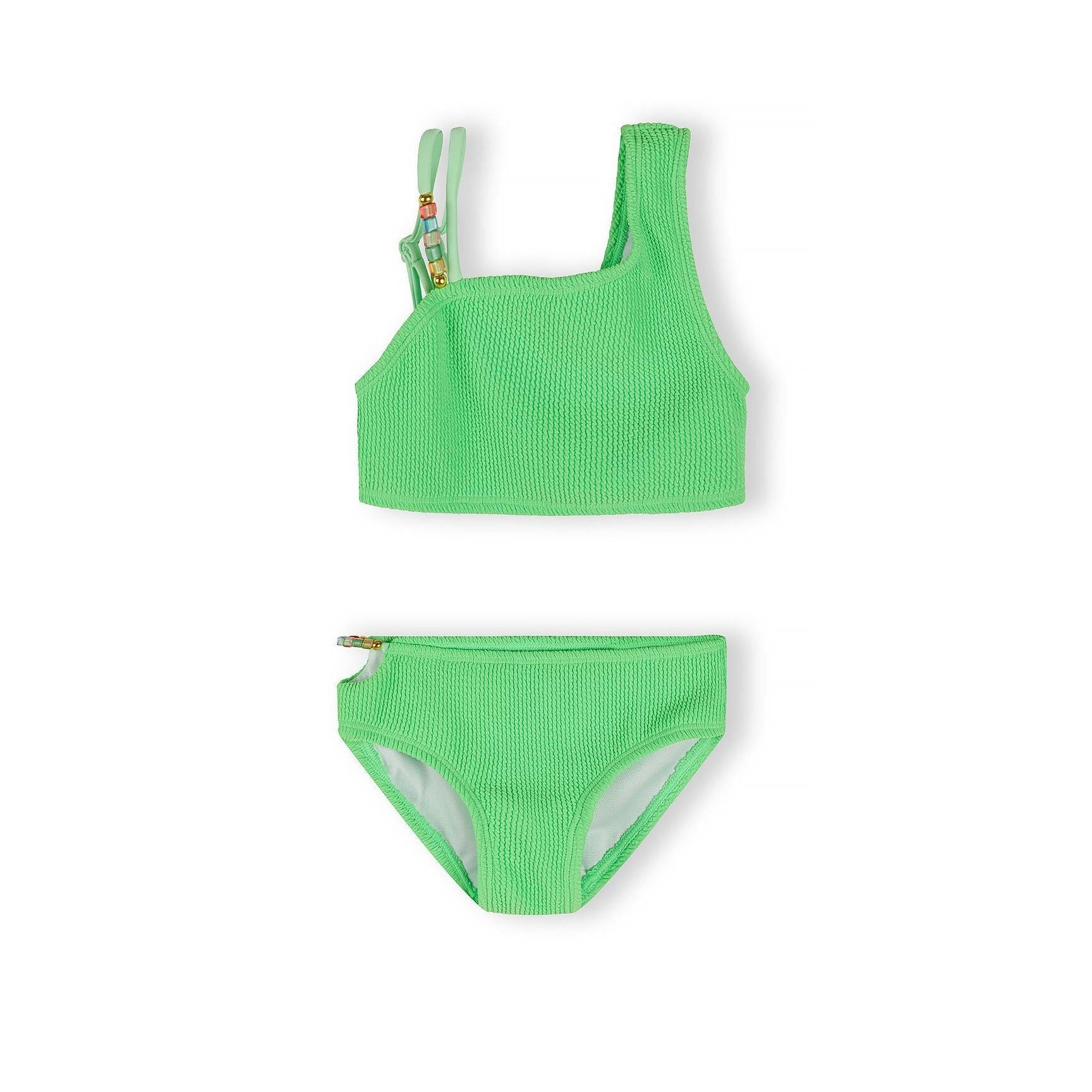 Close-up detail of emerald green textured bikini top showing beaded shoulder strap with colourful decorative beads