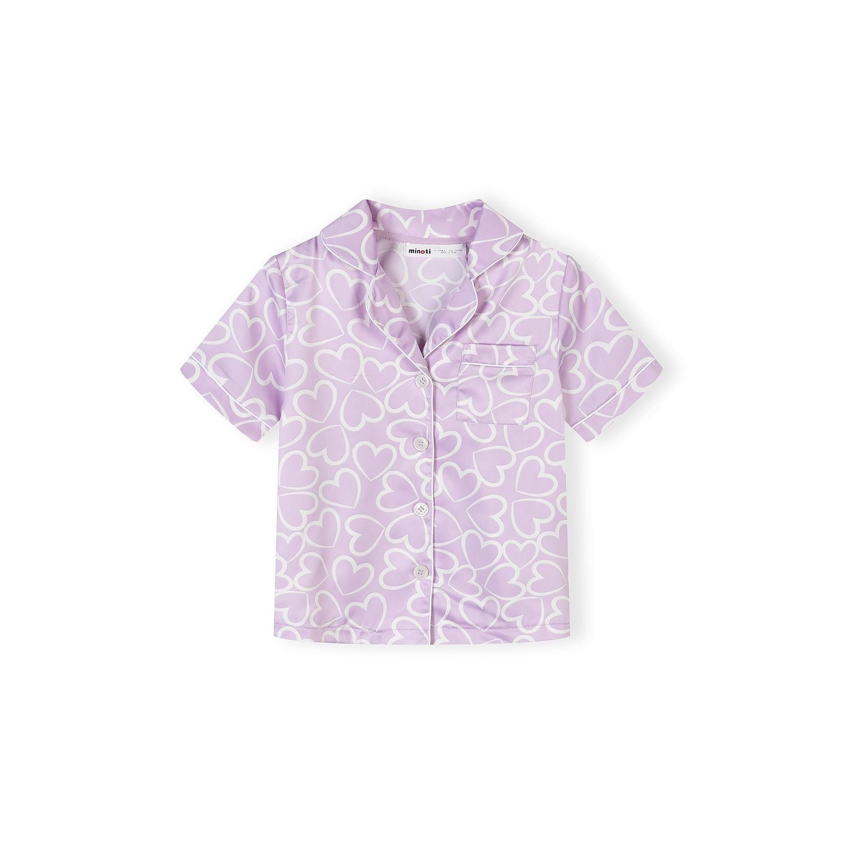Close-up view of lilac satin pyjama shorts with white heart print pattern and Minoti label visible at waistband
