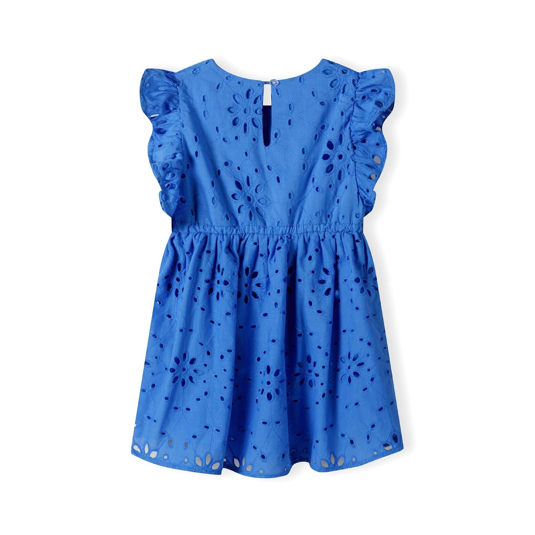 Back view of blue broderie anglaise dress on white background showing keyhole neckline with button closure and flutter sleeve details