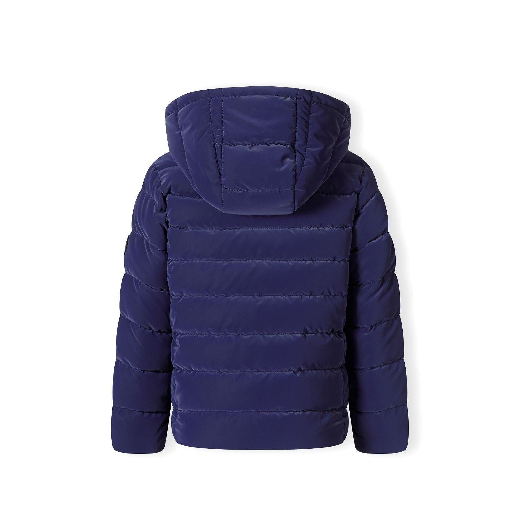 Close-up detail of navy padded jacket showing quilted texture, zip closure and soft padding construction