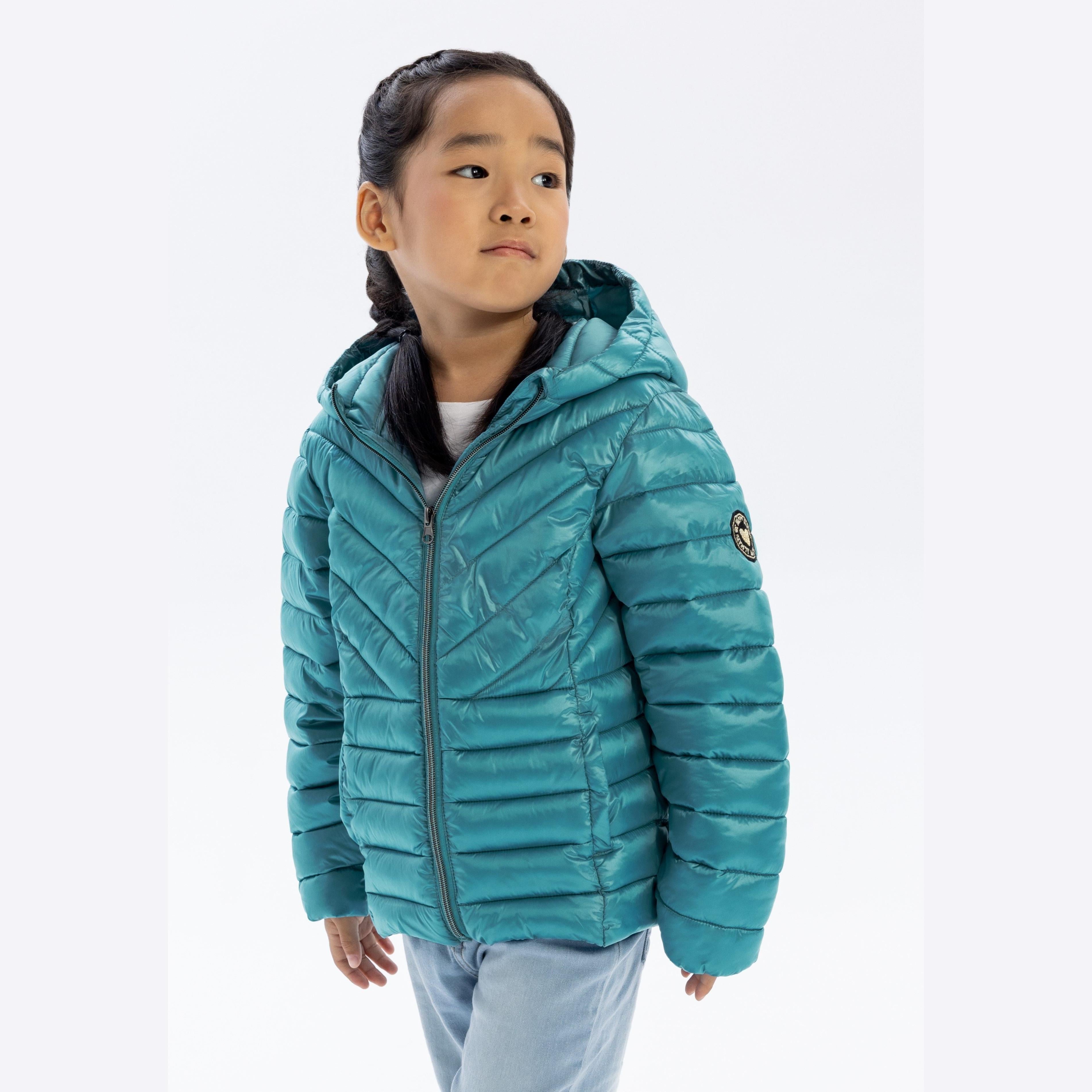 Girl wearing turquoise quilted hooded jacket with zip closure, standing against white background