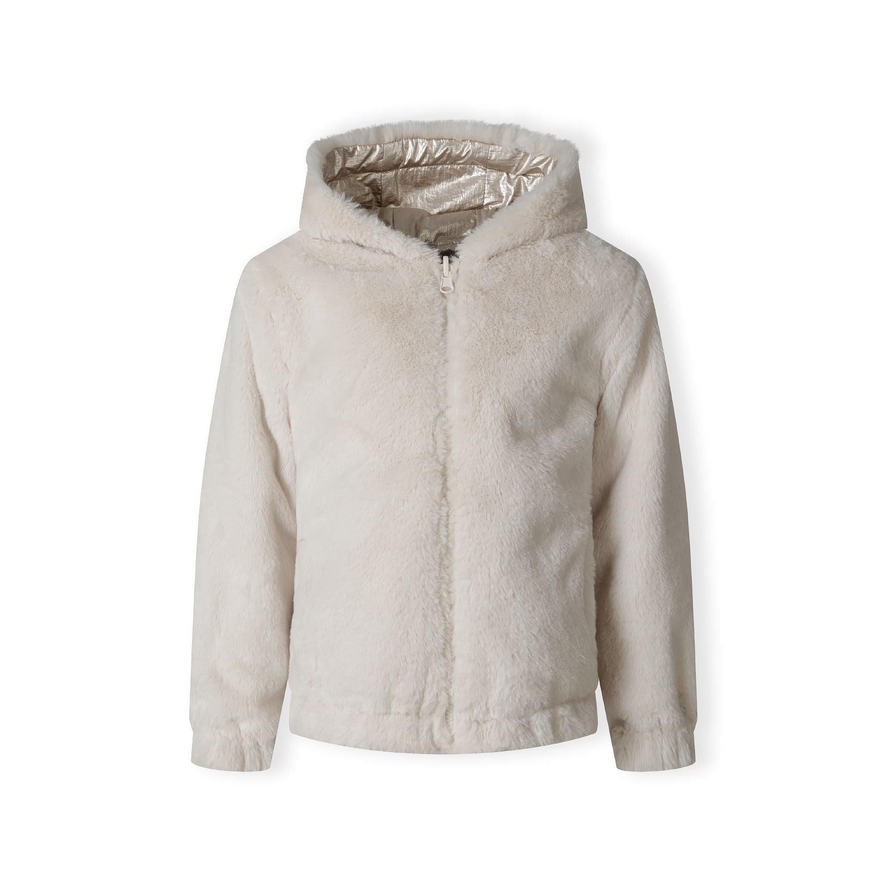 Close-up of cream teddy fur fabric texture showing soft fluffy pile and plush finish of jacket interior