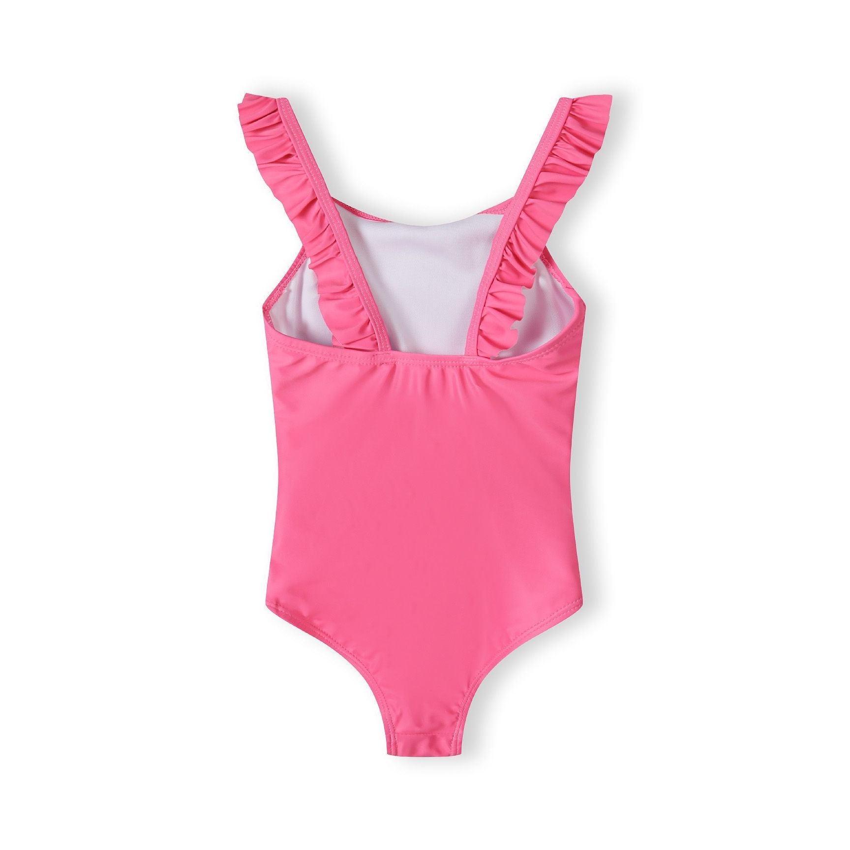 Back view of bright pink swimsuit showing ruffle shoulder straps and secure fit design on white background