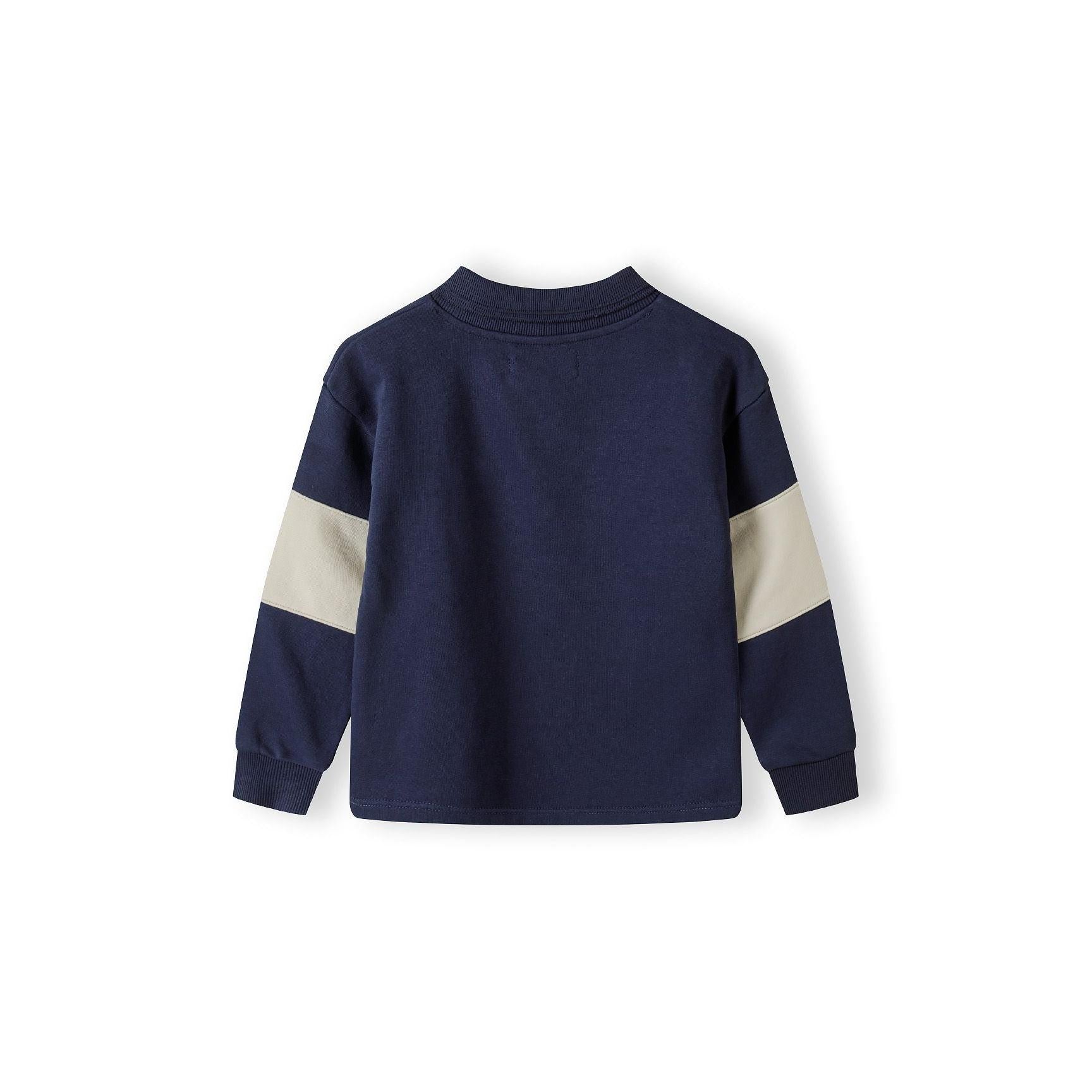Navy fleece jumper laid flat showing back view with cream sleeve panels on white background