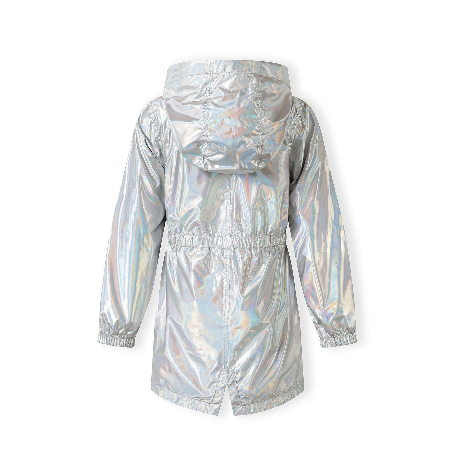 Close-up detail of silver iridescent rain jacket fabric showing the shimmery holographic effect, drawstring waist, and cargo pocket with snap closure