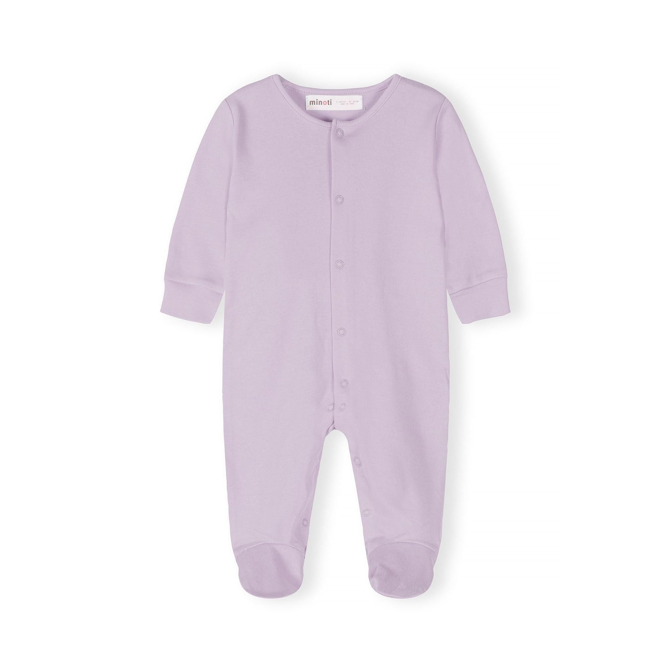 Close-up detail of pink sleepsuit showing Minoti brand label and snap button fastening system along the front opening