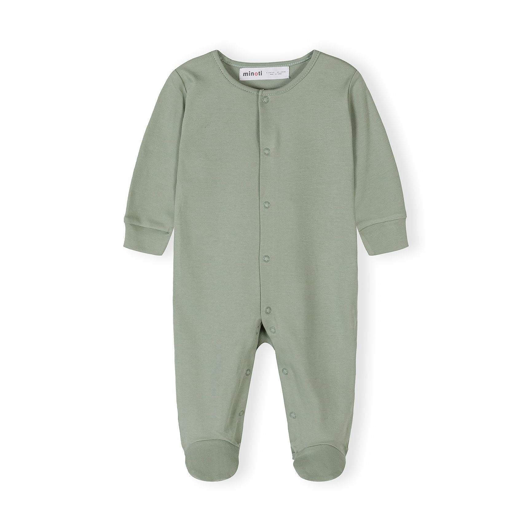 Close-up detail of light blue sleepsuit showing Minoti label, snap button closure and ribbed collar construction