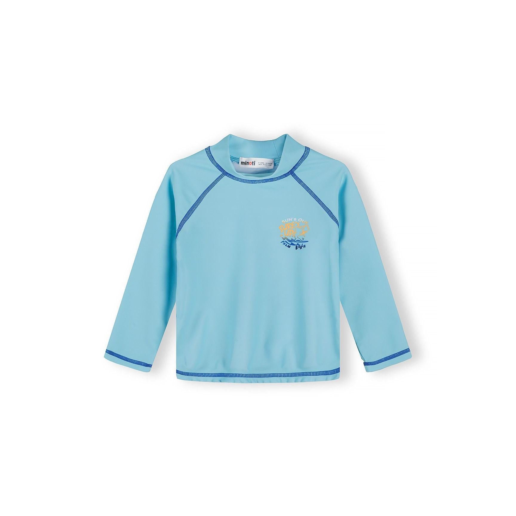 Close-up detail of solid light blue swim t-shirt showing chest print with text and wave design, blue contrast stitching visible around neckline