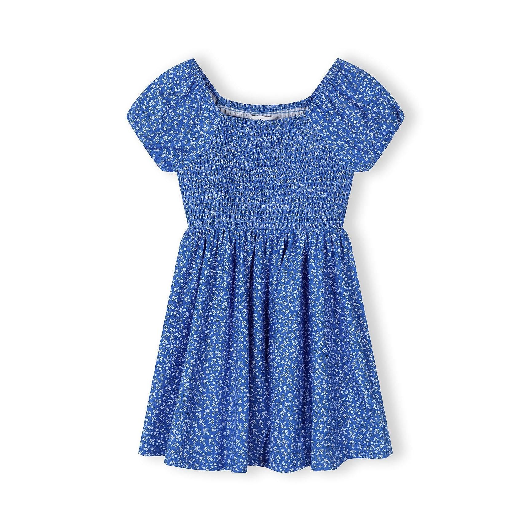 Blue floral dress with shirred bodice and cap sleeves displayed flat against white background, showing full-length A-line silhouette