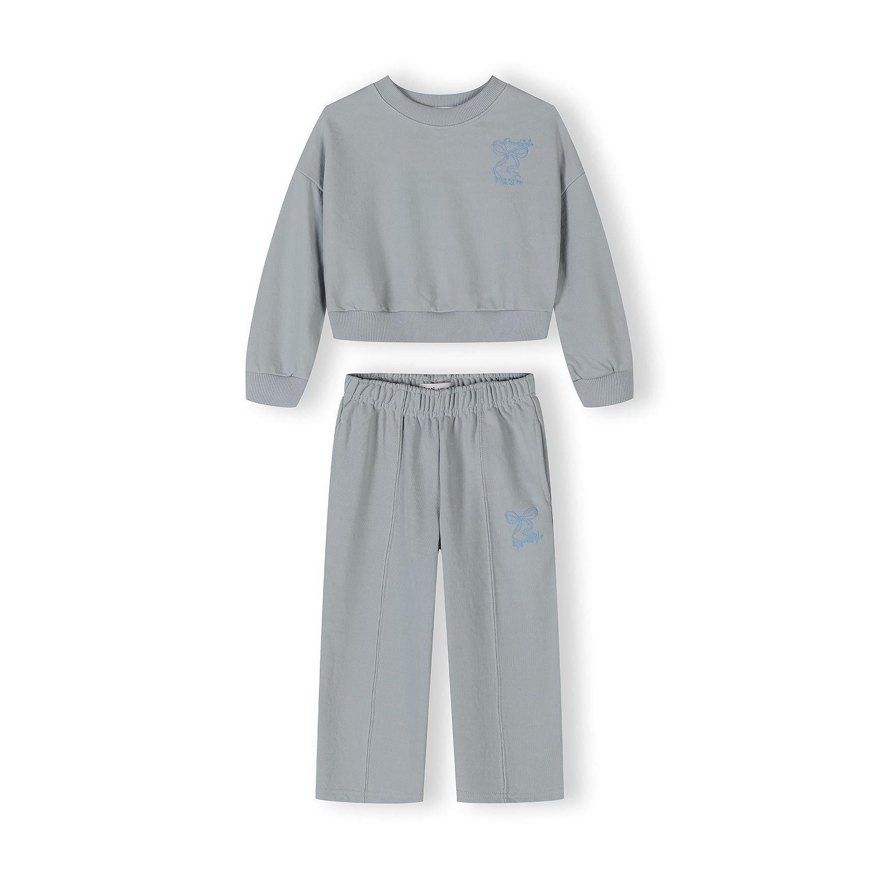 Light blue cropped sweatshirt laid flat showing California embroidered graphic with palm tree design on back