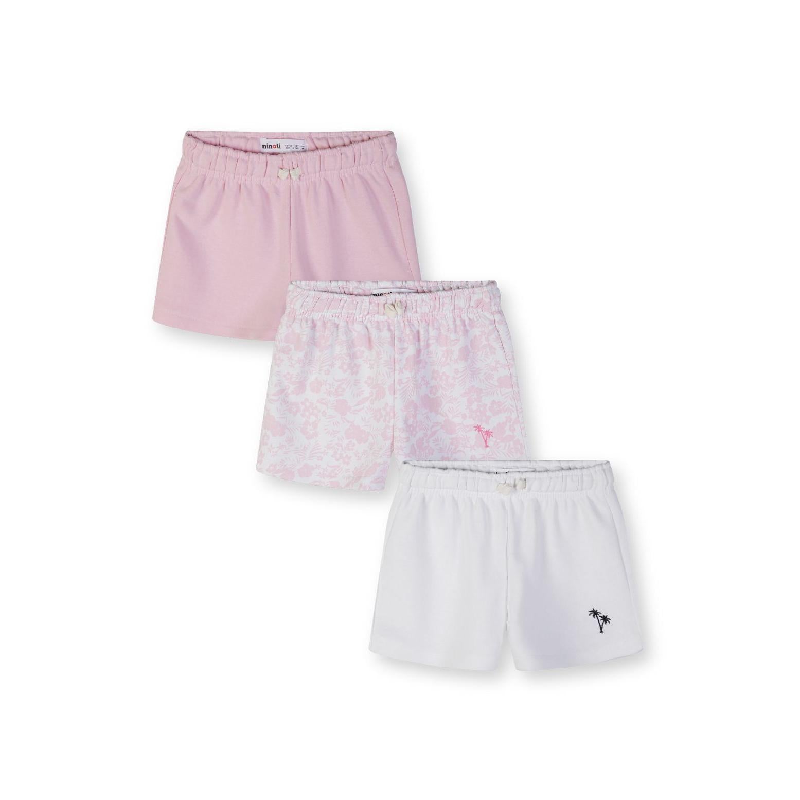 Three girls shorts laid flat showing pink, floral print and white styles with elastic waistbands and palm tree embroidery on white background
