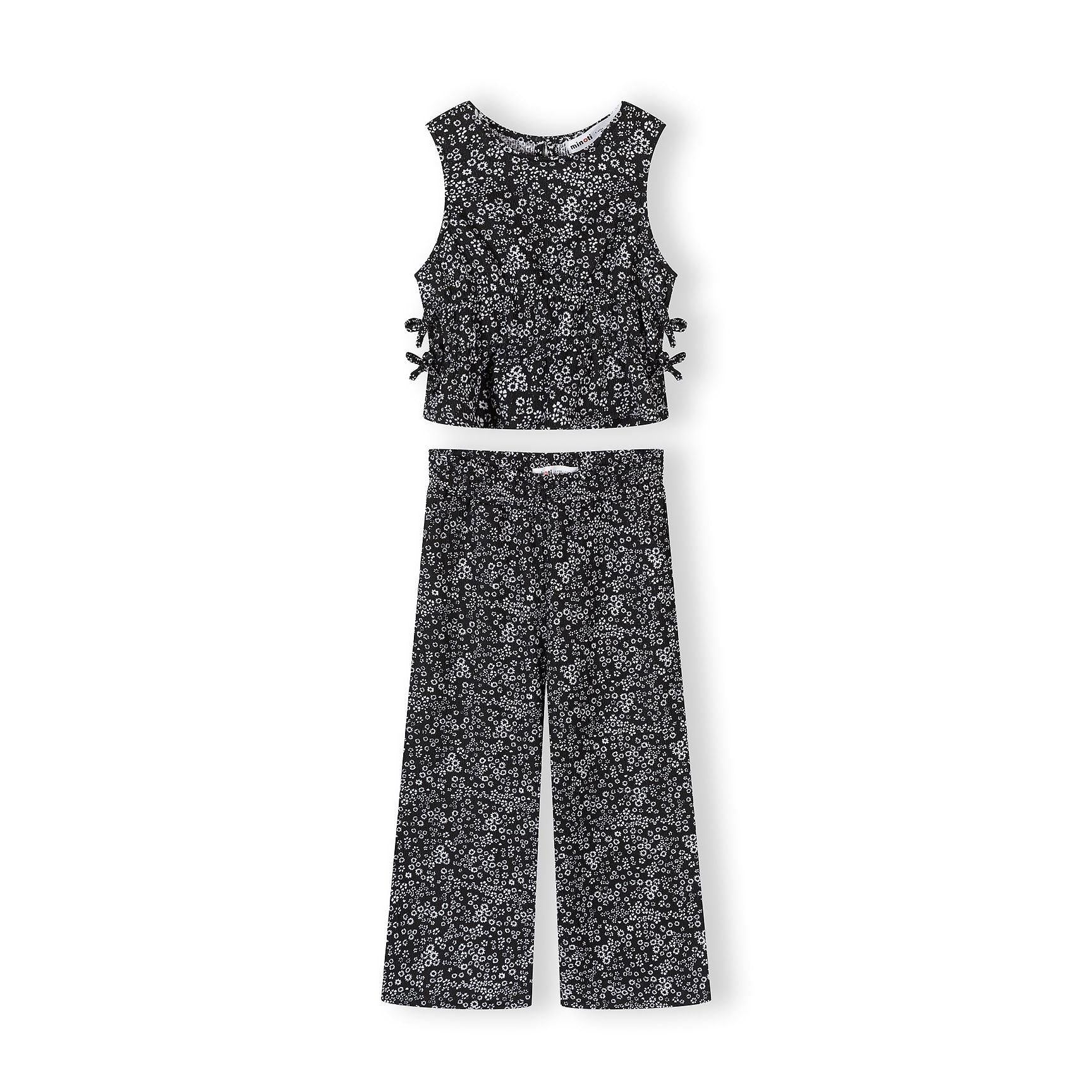 Black jersey set with small white floral print displayed flat on white background, showing sleeveless top with side ties and wide-leg trousers