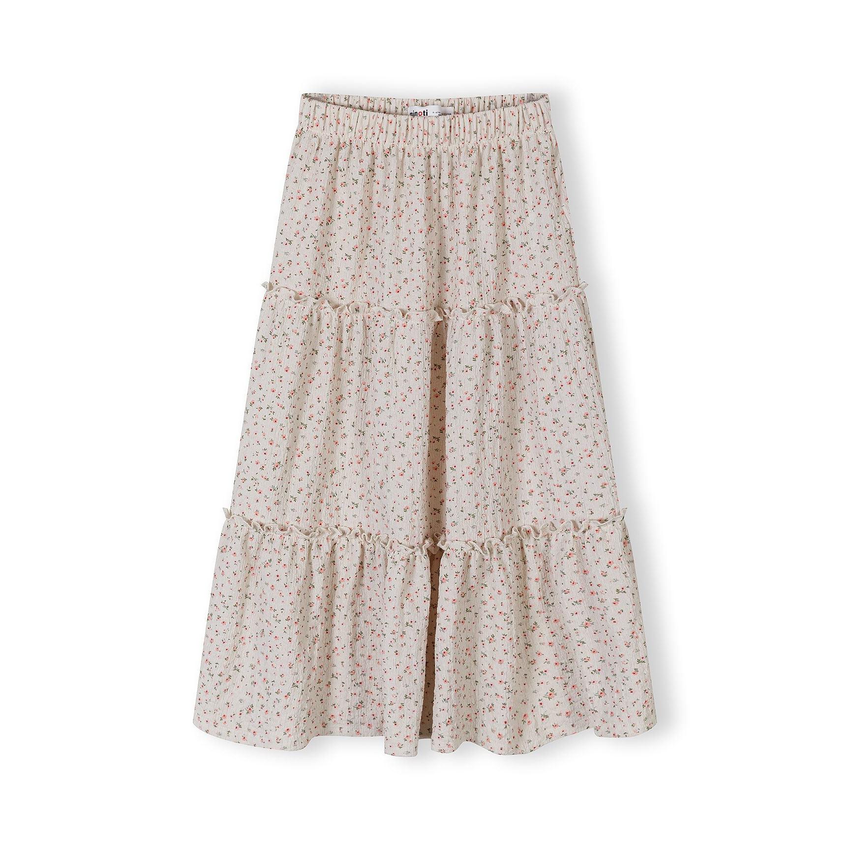 Front view of cream floral maxi skirt with tiered design and elasticated waist on white background