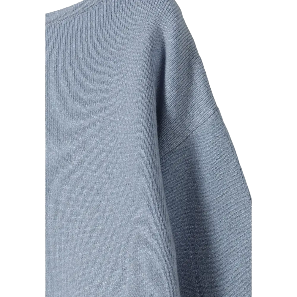 Close-up detail of light blue textured knit fabric showing ribbed texture and construction quality